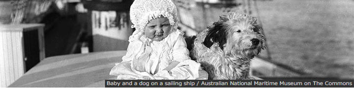 Baby and a dog on a sailing ship